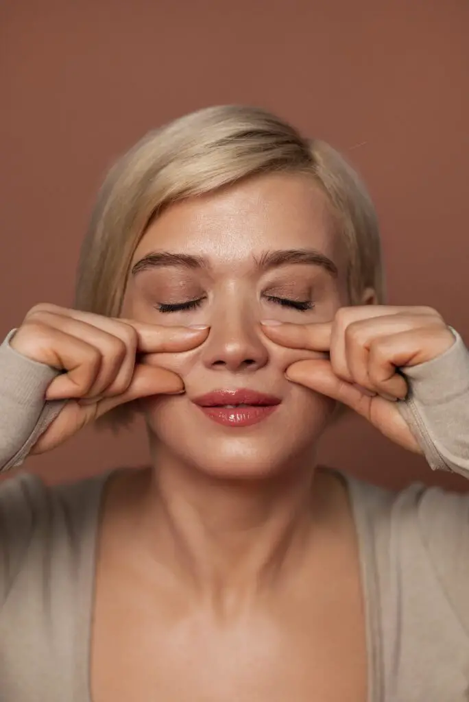front view woman practicing facial yoga