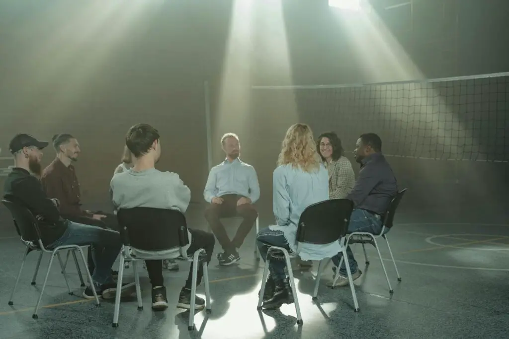 People Sitting on Chairs Inside Room