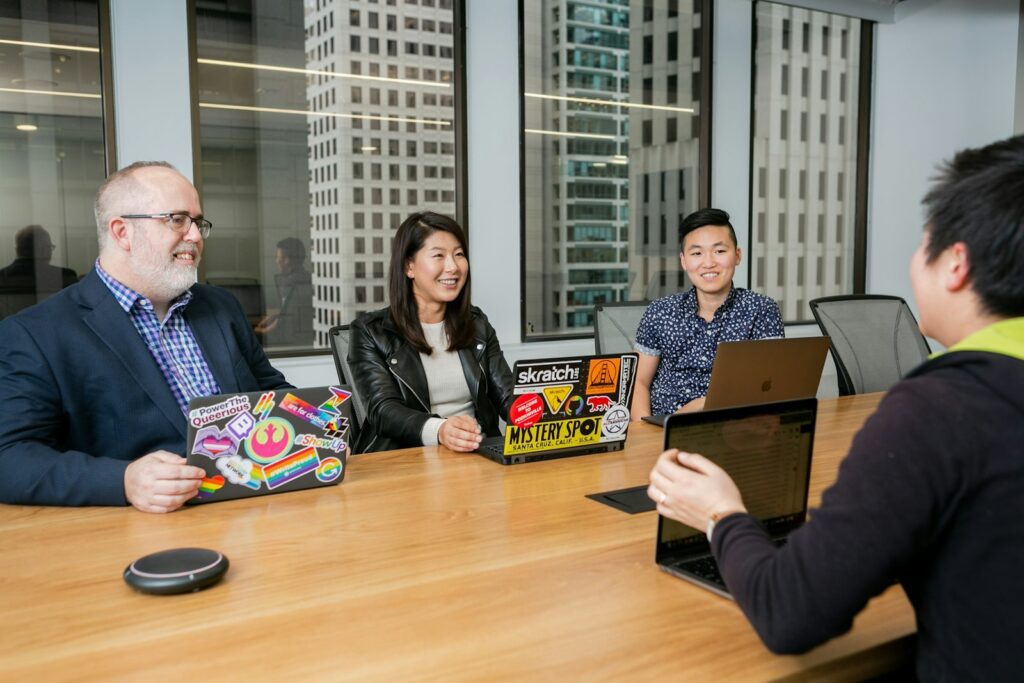 people in a design meeting in an office boardroom