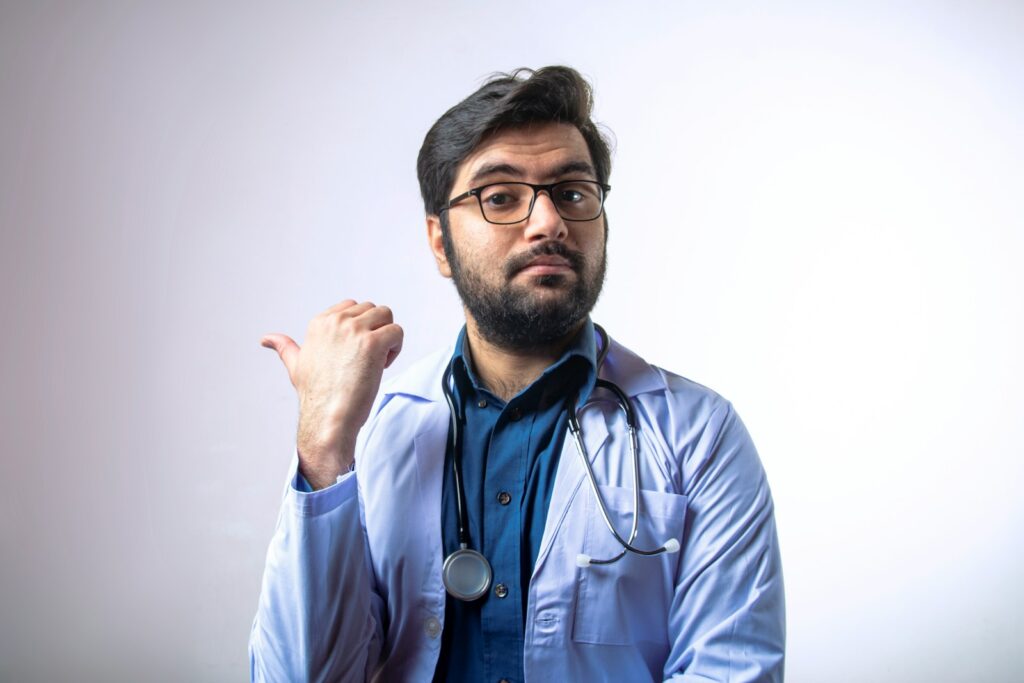 How a Lawyer Defends Against Healthcare Fraud Charges 2 man in blue dress shirt wearing black framed eyeglasses
