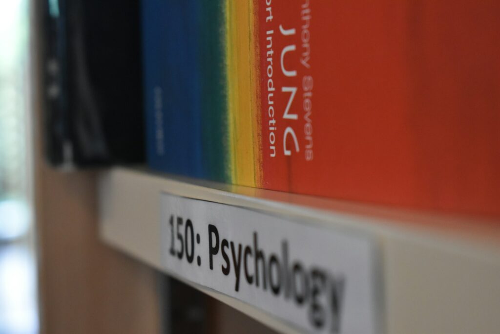 How Health Psychology Complements Traditional Counseling and Social Work Roles 2 a close up of a book shelf with books on it