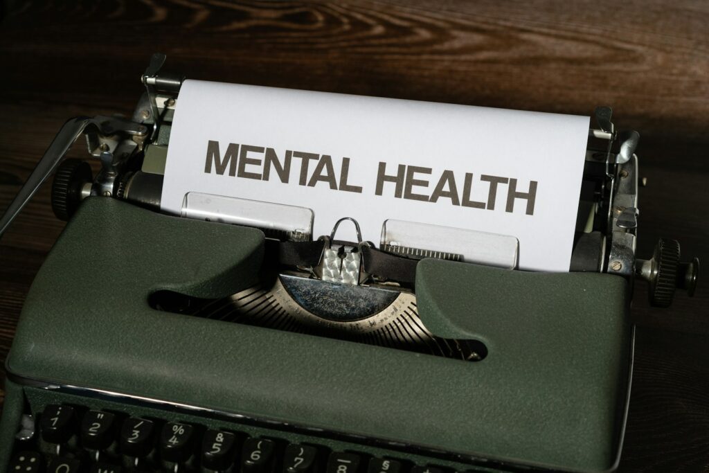 Combining Mindfulness Practices with Professional Mental Health Support 2 a close up of a typewriter with a paper that reads mental health