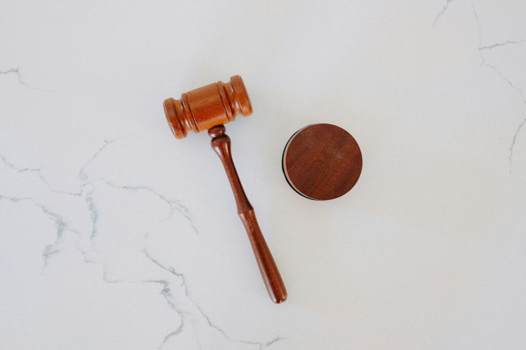 Drug Crime Defense: What You Need to Know After an Arrest 2 wooden gavel and block on marble