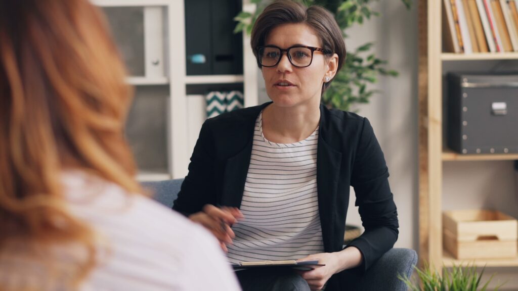 The Mental Health Careers Designed Around Populations Rather Than Individual Patients or Cases 2 a woman sitting on a couch talking to another woman